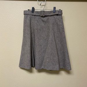 Brown A-line skirt with belt buckle detail